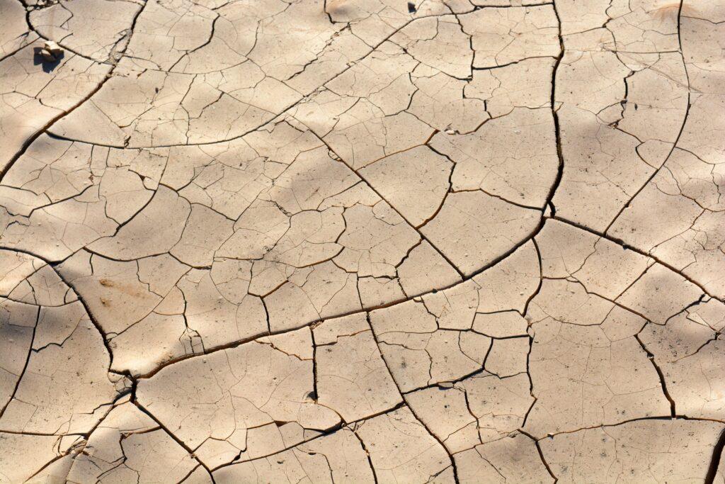 cracked dry ground symbolizing scarcity, limited resources, and urgency in ethical sales strategies