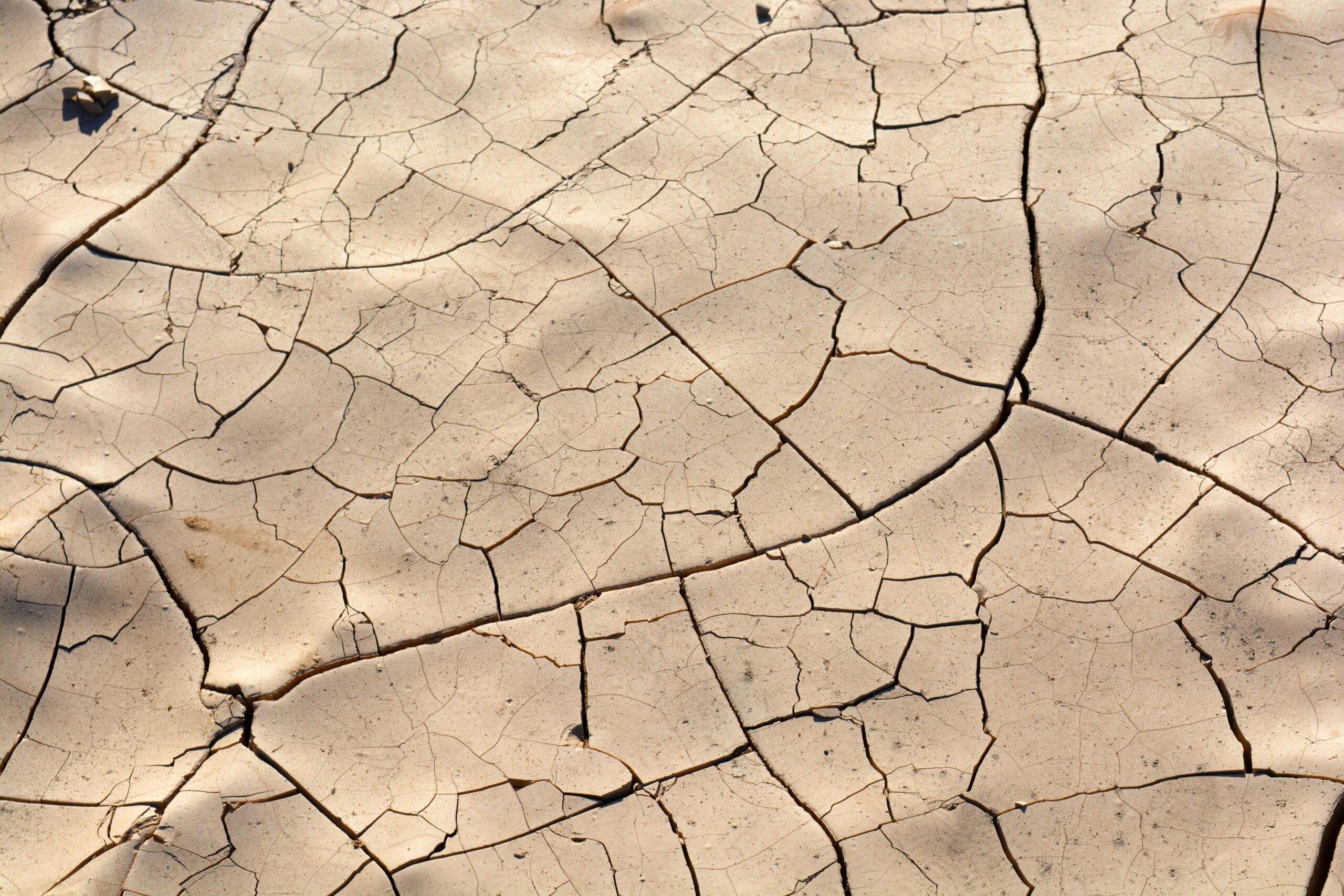 cracked dry ground symbolizing scarcity, limited resources, and urgency in ethical sales strategies